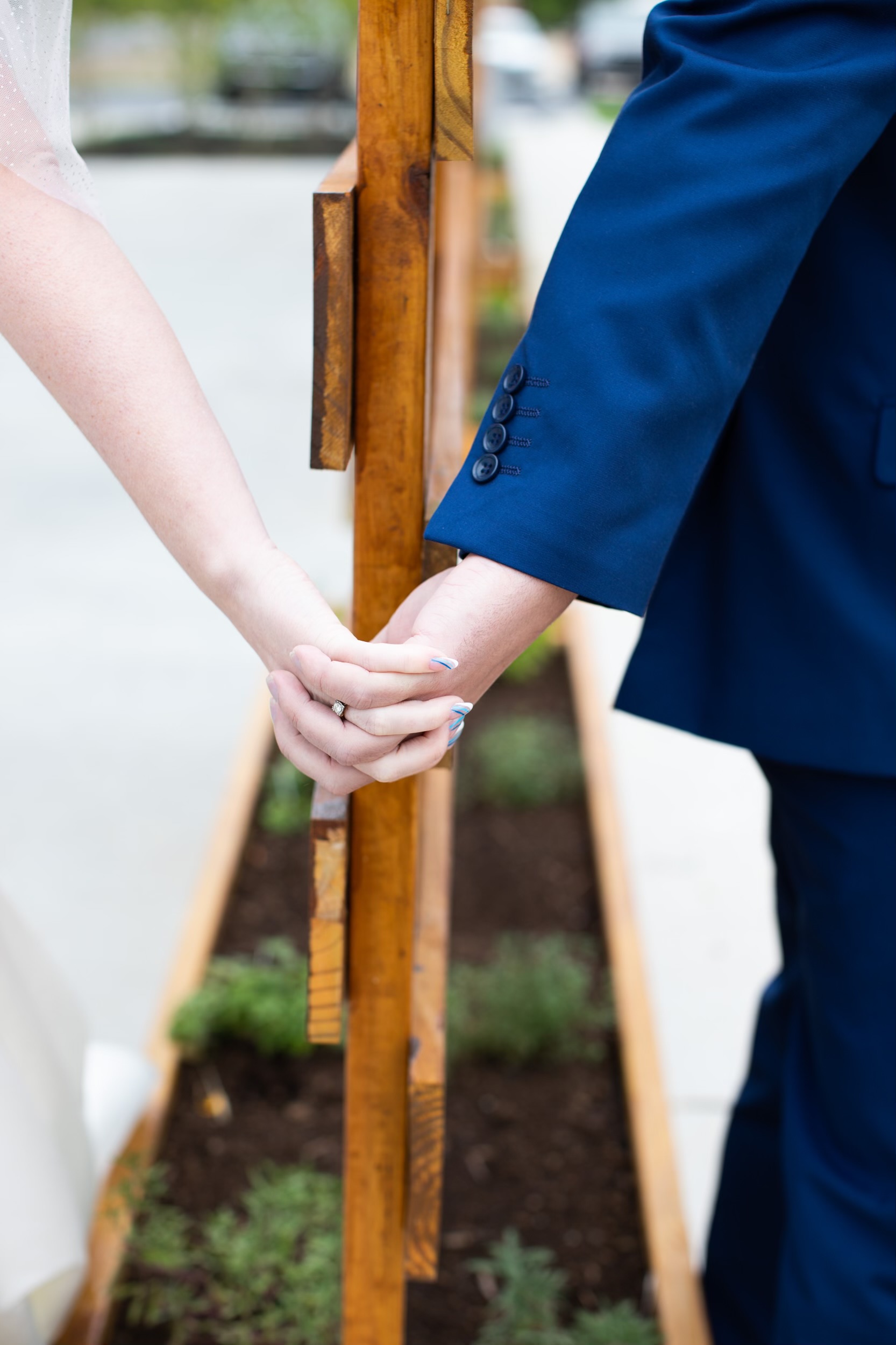A close-up of a couple holding hands