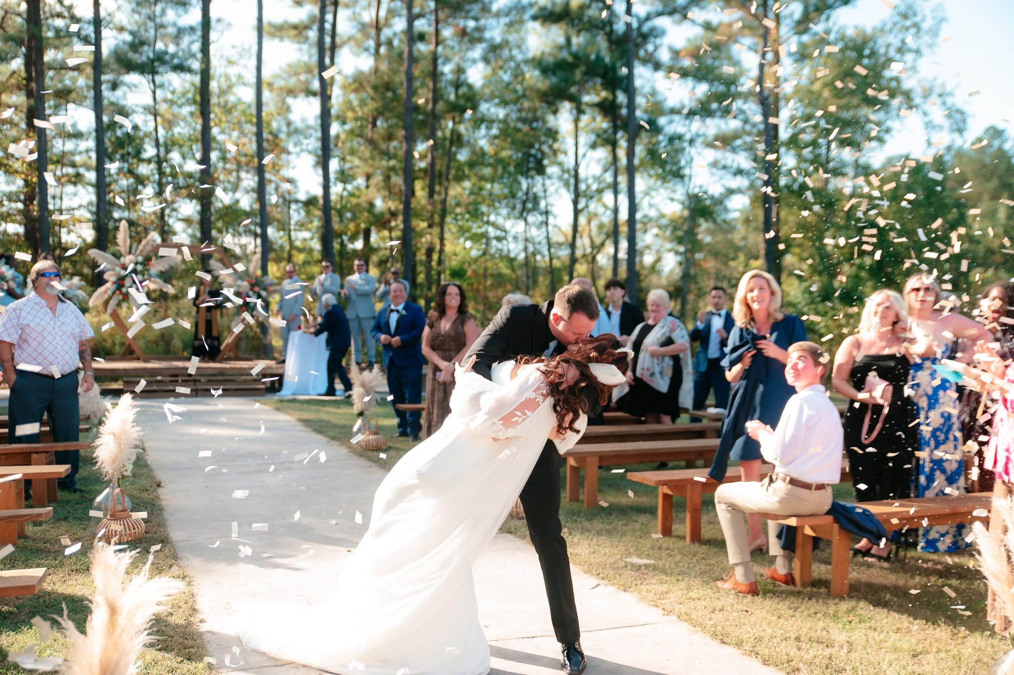 A joyful moment during an outdoor wedding ceremony